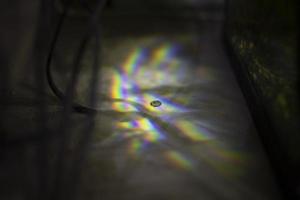 Glare of light on surface. Defraction of rays. photo