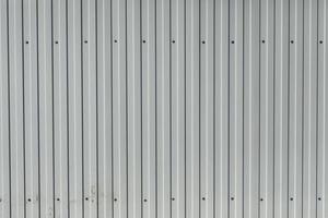 Steel fence. Metal profile sheet of white color. photo