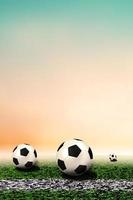 Soccer ball in light background lawn for content or copy space. Football concept. Soccer football field stadium grass line ball background texture photo