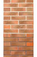 The texture of the brick column is lined with even brick rows with curly elements. photo