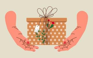 Hands holding Christmas gift in kraft paper with tag and berries. Present box in craft wrapping paper with bow and branches. Colored flat vector illustration isolated on beige background.