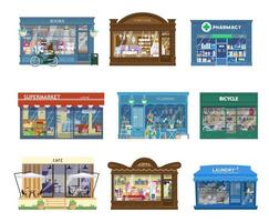 Vector Collection Of Shops Buildings Exteriors. Showcases With Goods. Book Shop, Furniture Shop, Pharmacy, Supermarket, Flower Shop, Bicycle, Cafe, Gift Shop, Laundry. Isolated On White.