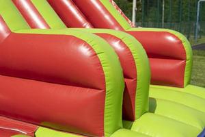 Red inflatable design. Inflatable slide. photo