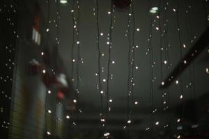 Garlands on glass. Small lamps. photo