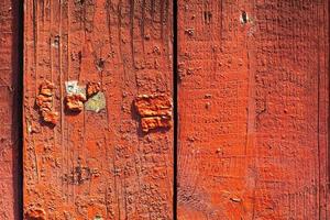 Red wooden wall. Mahogany texture. Bright paint. photo