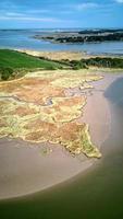 Unusual colours of River Alde at low tide photo