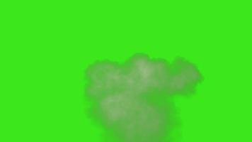 Eine staubige Kugel trifft auf eine Wand, aus der Trümmerstücke herausfliegen. pulverexplosion auf grünem bildschirmhintergrund. aufprallstaubpartikel. Staubexplosion vor schwarzem Hintergrund, Zeitlupe aus nächster Nähe. vfx