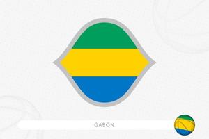 Gabon flag for basketball competition on gray basketball background. vector
