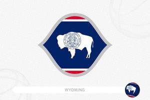 Wyoming flag for basketball competition on gray basketball background. vector