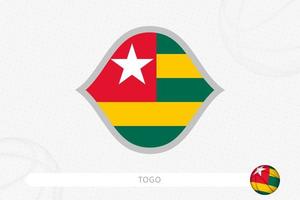 Togo flag for basketball competition on gray basketball background. vector