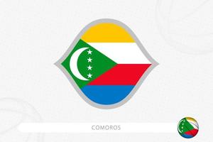 Comoros flag for basketball competition on gray basketball background. vector