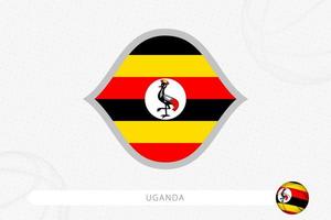 Uganda flag for basketball competition on gray basketball background. vector