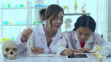 Asian schoolgirls are studying science and technology in a lab. Teachers teach science to students for learning process skills. video