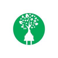 Green energy electricity logo concept. Electric plug icon with tree. vector