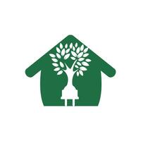 concepto de logotipo de electricidad de energía verde. icono de enchufe eléctrico con árbol y hogar. vector