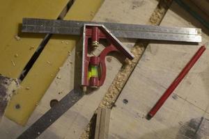 Line and level in workshop. Tool for measurements. Details of carpentry. photo