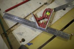 Line and level in workshop. Tool for measurements. Details of carpentry. photo