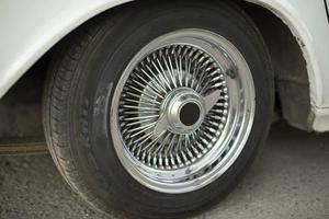 Old disc of car. Wheel is retro car. Details of rare transport. photo