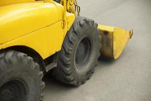 Yellow mini bulldozer. Small construction equipment. Diesel transport. photo