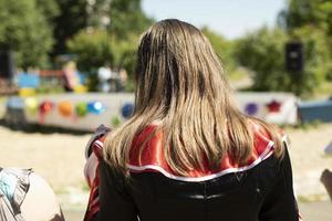 Long girl hair outside in summer. Woman's long hairstyle. photo