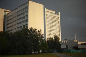 Large building in city. View of house with lots of windows. photo