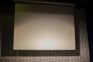 Auditorium. White screen for image projection. photo