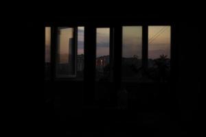 Window in evening. Glass windows in house. Evening sky behind glass. photo