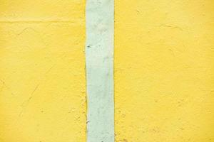 Yellow wall texture. Background yellow paint on wall. Bright color. photo