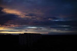 Evening sky. Purple clouds. Dark sky late in evening. photo