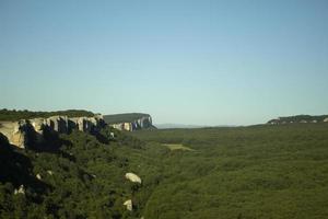 View of green valley. Beautiful summer landscape. Sky and greenery. photo