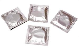 Condoms in seal package isolate on white background. photo