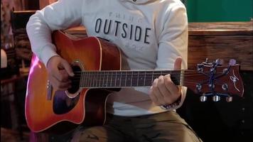 Man plays the guitar in front of bar counter video