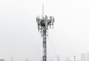 Telecommunication tower with sky background photo