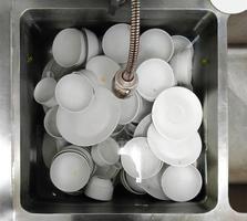 Top view many dirty dishes in kitchen sink photo