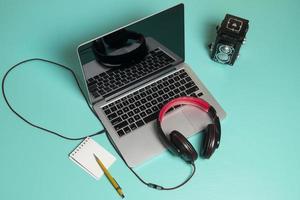 Red earphone on a notebook photo