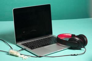 Red earphone on a notebook photo