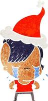 retro cartoon of a crying girl wearing santa hat vector