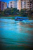 The beautiful boat diving in the lake. photo