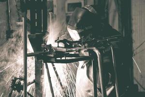 Welder at work in the factory photo