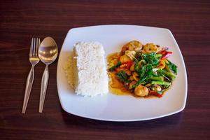 Rice with stir-fried seafood and basil photo