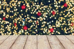 Christmas holiday background with empty wooden table photo