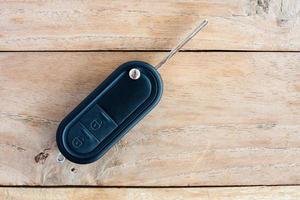 Car Key on old wood table background photo