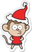 sticker cartoon of a surprised monkey wearing santa hat vector