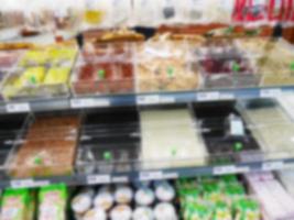 blur spice and herb shelf in supermarket photo