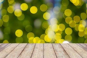 wood table with abstract christmas blurred background photo