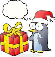 freehand drawn thought bubble cartoon christmas penguin with present vector