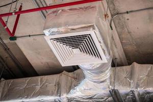 Ceiling air duct in large shopping mall photo