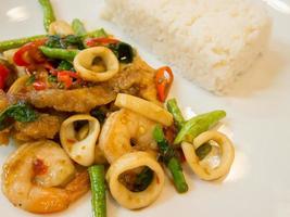 Rice with stir-fried seafood and basil photo