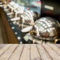 wood table top on buffet heated trays photo