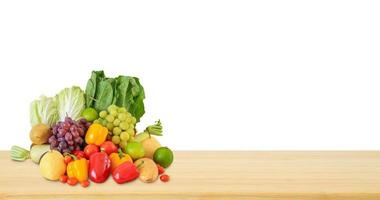 Fresh fruits and vegetables grocery product on wood table isolated on white background photo